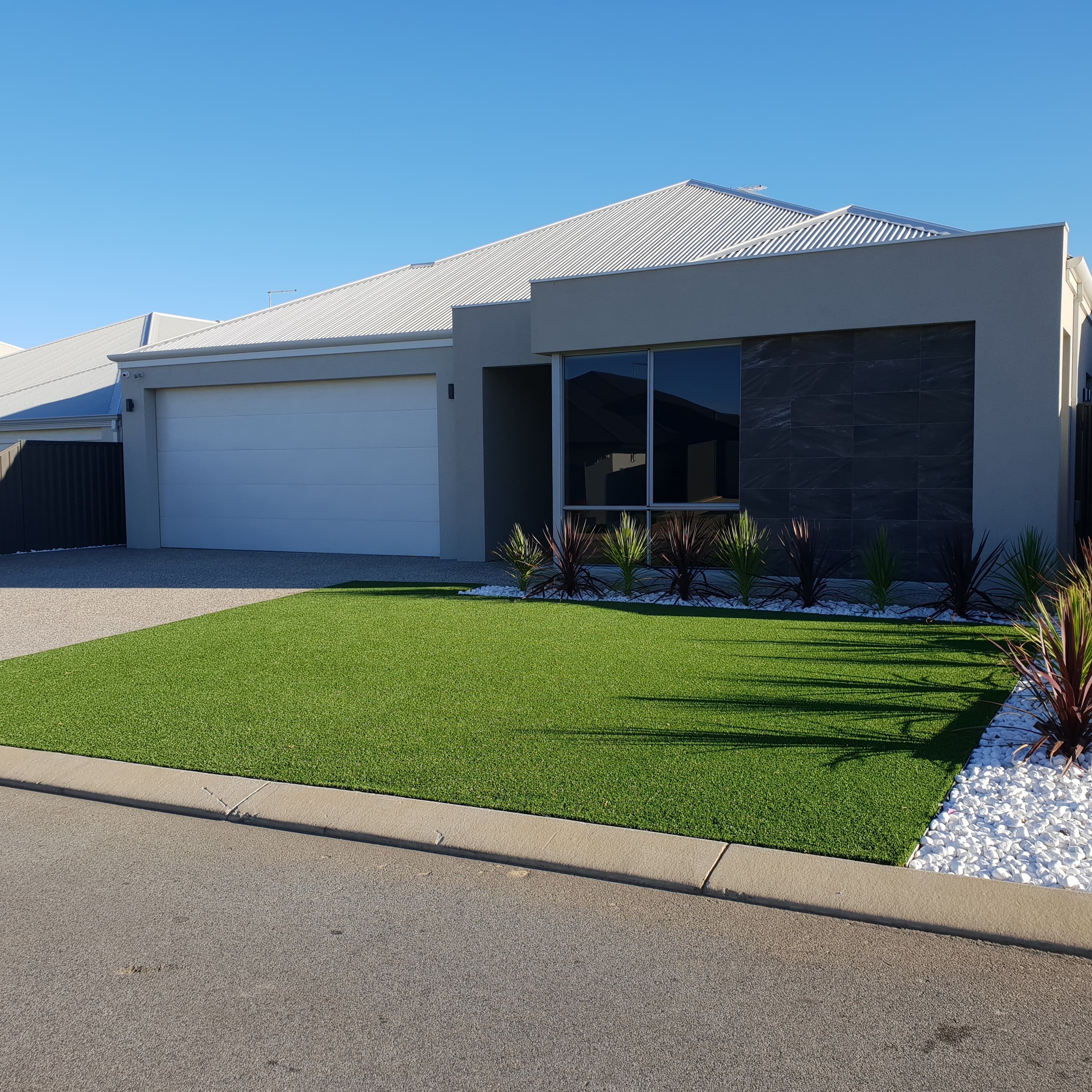 Artificial turf front lawn installation with garden bed, Perth