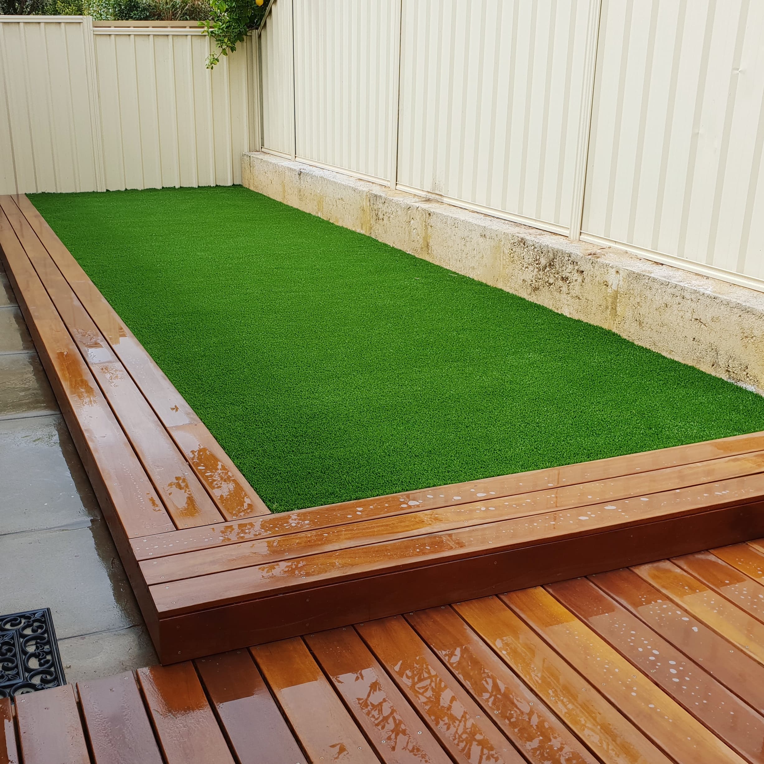 Artificial turf inset bordered by jarrah decking