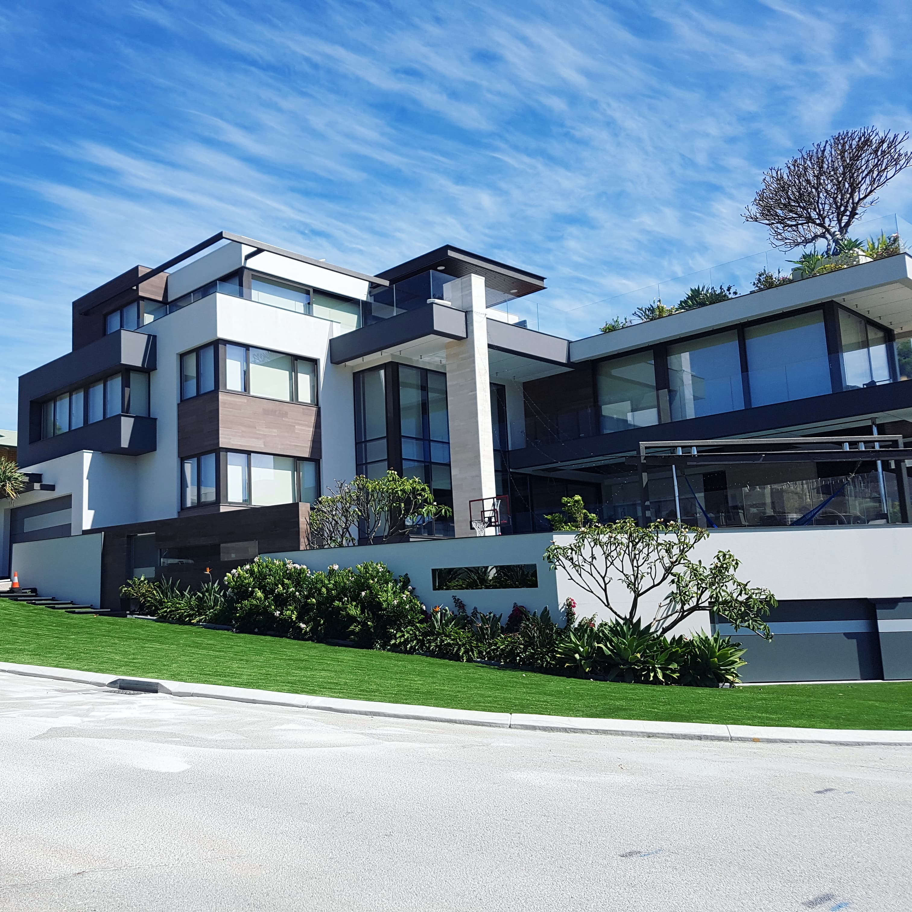 Striking modern Perth home with fresh artificial turf front lawn