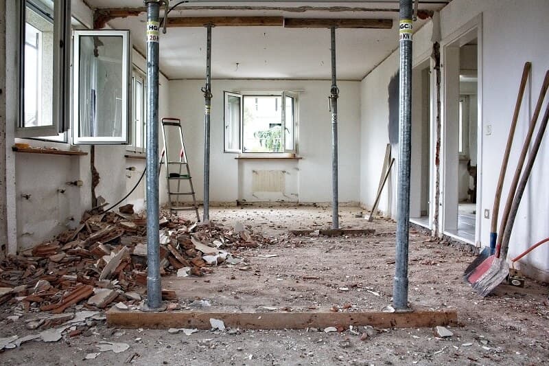 Interior of a home stripped back to bare walls and floor, ready for renovation